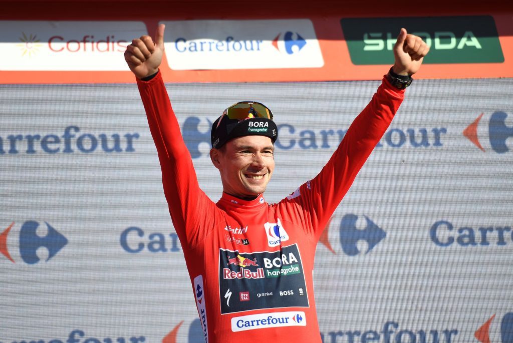 Winner of the stage Team Bora's Primoz Roglic celebrates on the podium wearing the overall leader red jersey during the stage 19 of the Vuelta a Espana, a 173,5 km race between Logrono and Alto de Moncalvillo, on September 6, 2024. (Photo by ANDER GILLENEA / AFP)