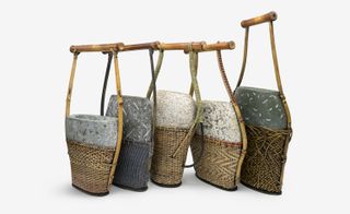 Five bags using Japanese weaving techniques, each holds a piece of granite