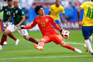 Mexico goalkeeper Guillermo Ochoa makes a save against Brazil at the 2018 World Cup.