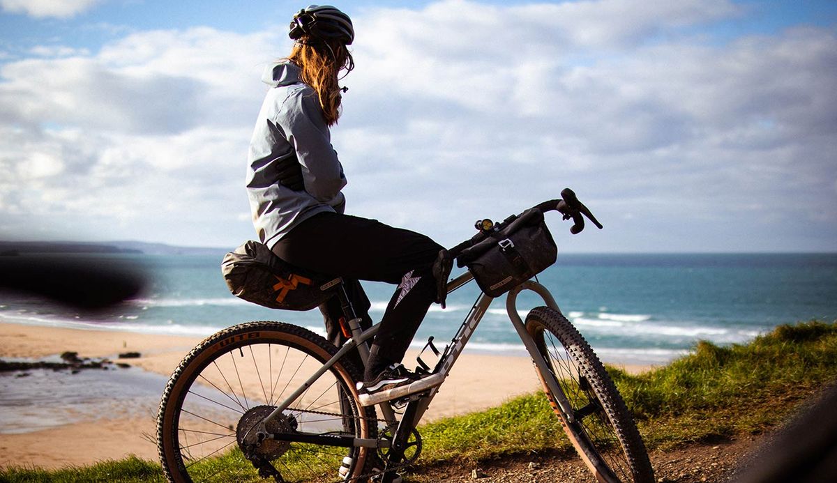 A rider on the Cotic Cascade looking out to sea