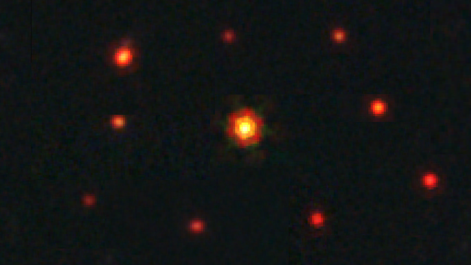 10 red dots on a black background