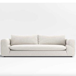 curved white boucle couch ideal for the quiet luxury aesthetic
