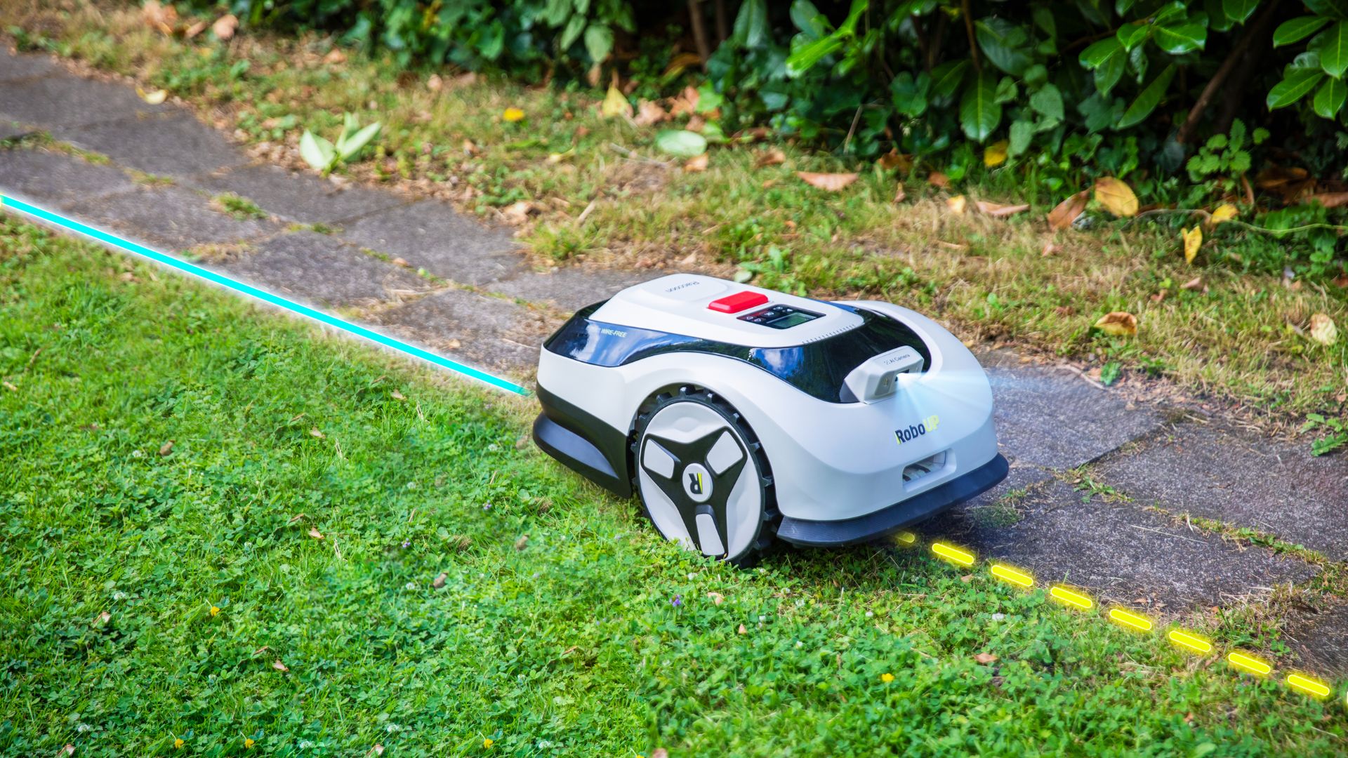 The RoboUP Raccoon SE 2 using its AI camera to mow to the edge of a lawn