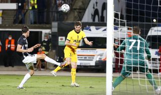 Tottenham’s Ben Davies challenges Lokomotiv’s Birsent Karagaren