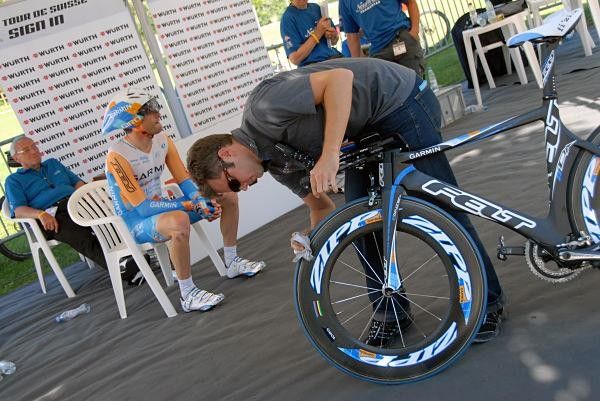 Christian Vande Velde waits for his start as his bike gets some attention.