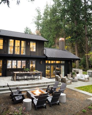 Black house with large, zoned backyard