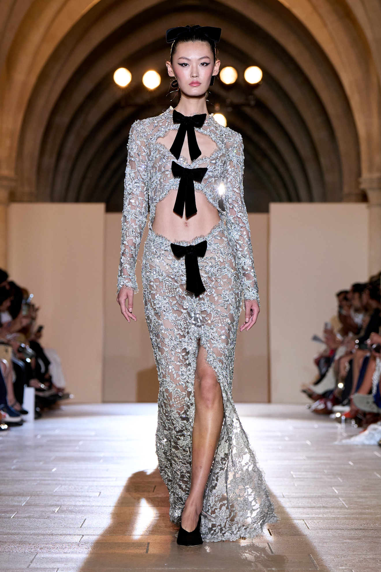A model wore a crystal illusion gown on the Tamara Ralph Fall 2024 Couture runway