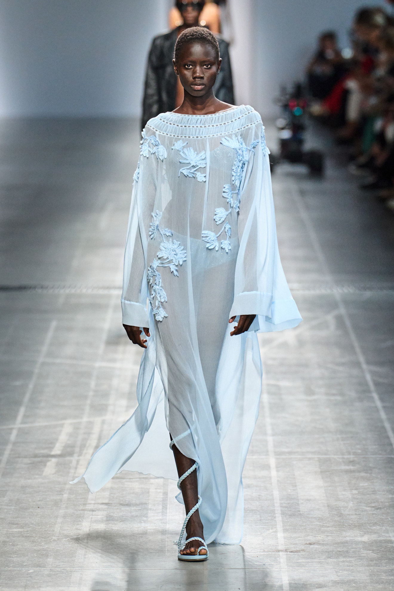 Pastel Fashion Colour Trends: A model wears a sky blue dress on the Ermanno Scervino spring/summer 2025 runway