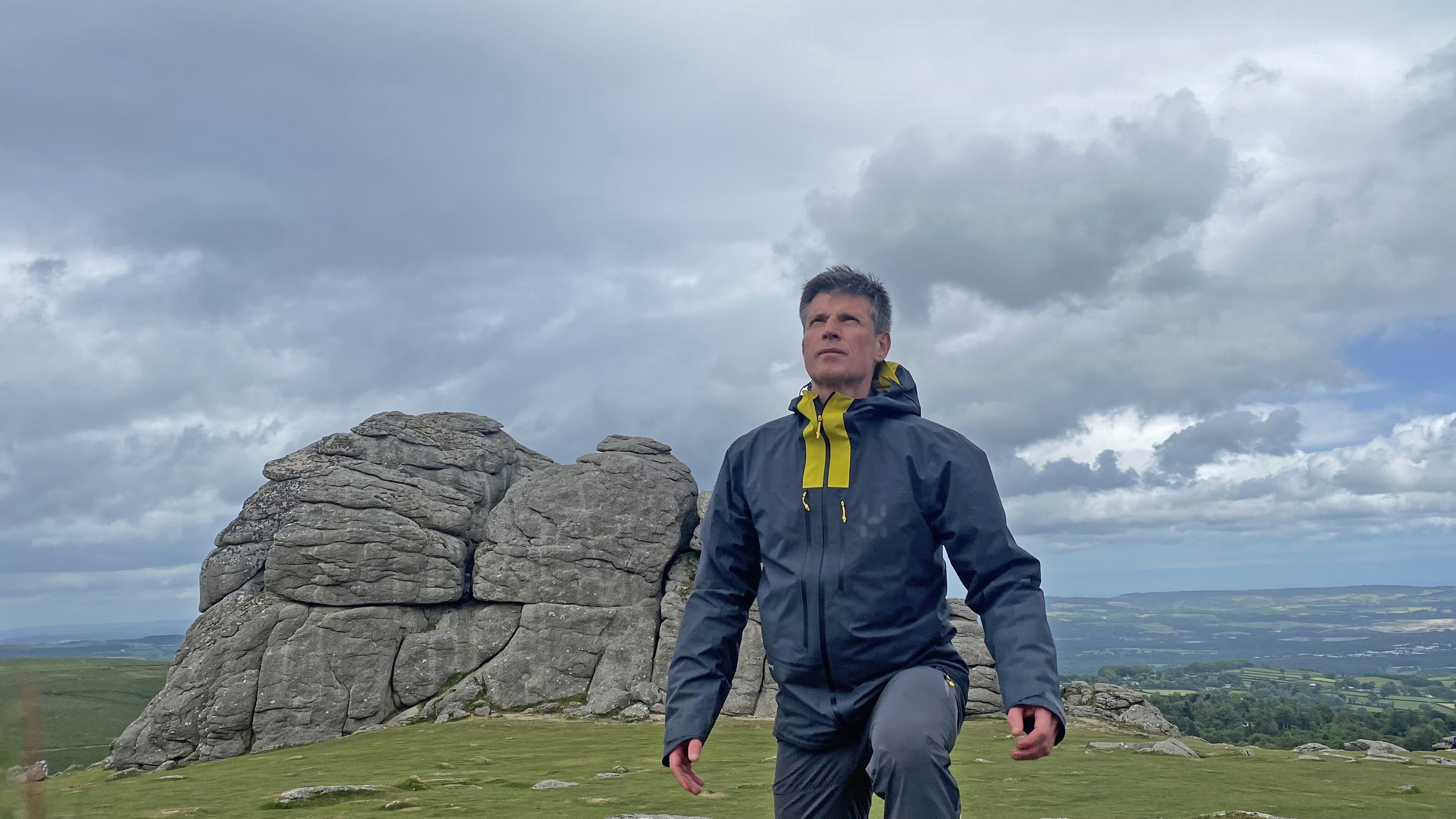 Hiker wearing the Haglöfs L.I.M. ZT II GTX Jacket by Haytor on Dartmoor