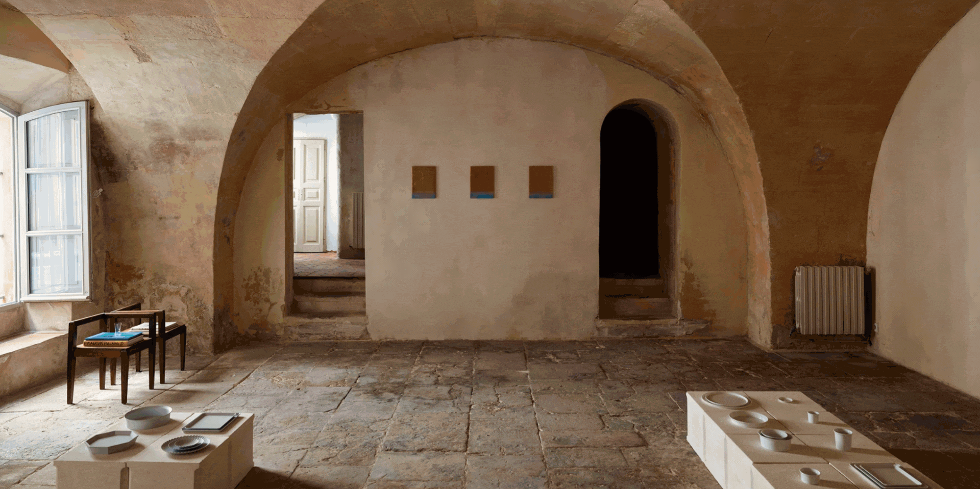 A rotating gif of design showrooms, art museums, hotels, natural wonders, and animals.