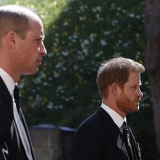 topshot britains prince william, duke of cambridge l and britains prince harry, duke of sussex follow the coffin during the ceremonial funeral procession of britains prince philip, duke of edinburgh to st georges chapel in windsor castle in windsor, west of london, on april 17, 2021 philip, who was married to queen elizabeth ii for 73 years, died on april 9 aged 99 just weeks after a month long stay in hospital for treatment to a heart condition and an infection photo by alastair grant various sources afp photo by alastair grantafp via getty images