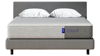 The Casper Original mattress sat on a grey bedframe and dressed with two white pillows