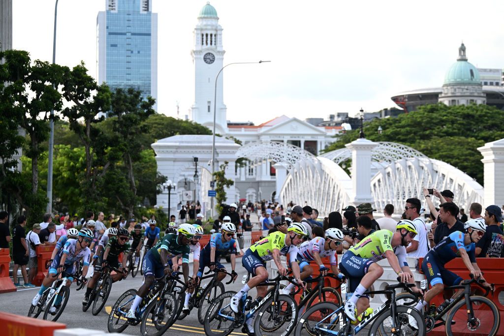 SINGAPORE SINGAPORE NOVEMBER 10 LR Yukiya Arashiro of Japan and Criterium Legends Team Biniam Girmay of Eritrea Hugo Page of France and Team IntermarcheCircusWanty and Team IntermarcheCircusWanty Green Sprint Jersey and a general view of the peloton competing during the 3rd Tour de France Prudential Singapore 2024 Criterium a 575km one day race from Singapore to Singapore on November 10 2024 in Singapore Photo by Tim de WaeleGetty Images