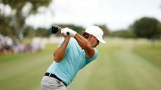 Captain Brooks Koepka of Smash GC hits his shot from the fifth tee during Day One of the LIV Golf Invitational - Miami at Trump National Doral 