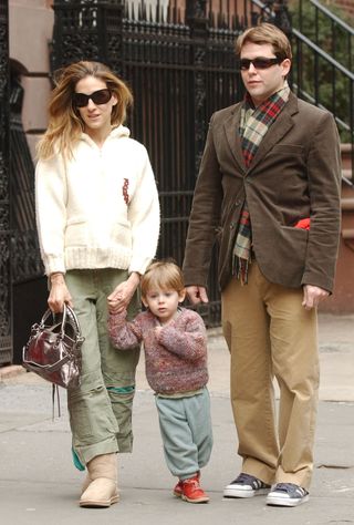 Sarah Jessica Parker (L) walks through Greenwich Village with her husband Matthew Broderick (R) and son James and on March 26, 2005 in New York City.