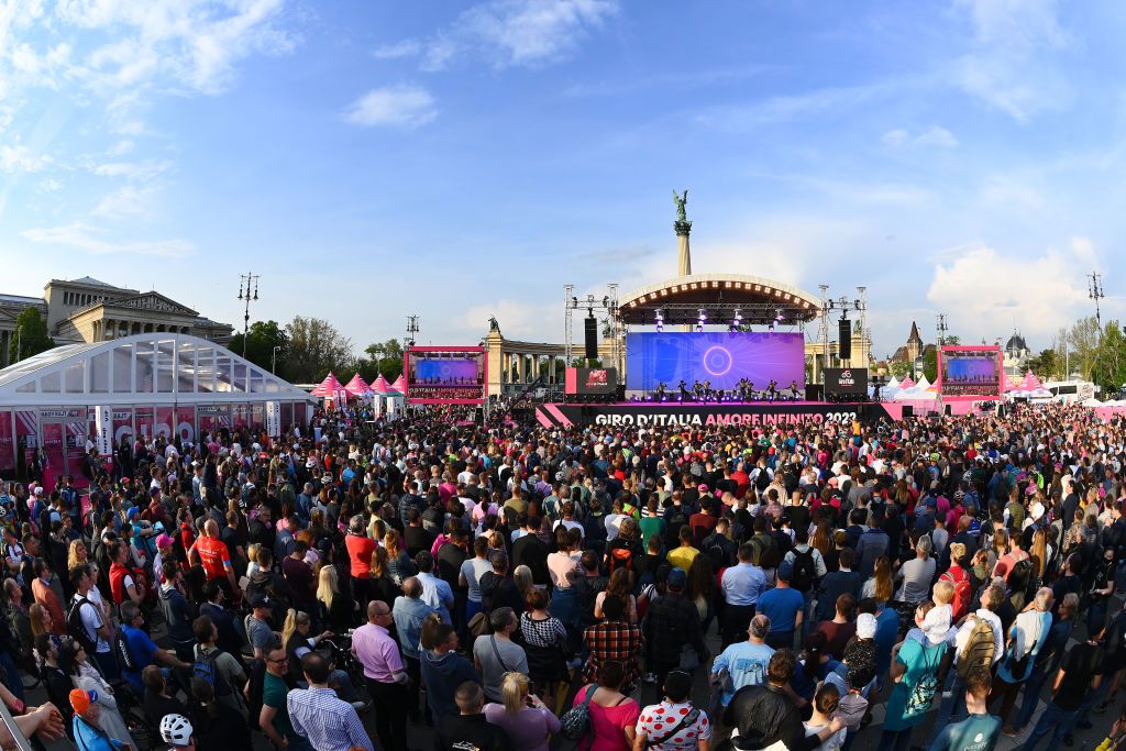 BUDAPEST HUNGARY MAY 04 Dancers perform on the stage while fans cheer during the Team Presentation of the 105th Giro dItalia 2022 at Heroes Square Giro WorldTour on May 04 2022 in Budapest Hungary Photo by Tim de WaeleGetty Images