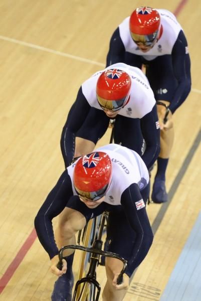 Great Britain's Philip Hindes, Jason Kenny and Chris Hoy set a world record en route to gold in the men's team sprint.