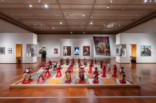 A giant chess set on the floor of the Toledo Museum of Art as part of the exhibition "Strategic Interplay: African Art and Imagery in Black and White"