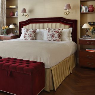 A white and red bedroom with a contrasting valance adding a pop of yellow to the room