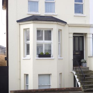 exterior of cream end of terraced house