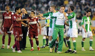 Sevilla and Real Betis players fight during a derby in 2008.
