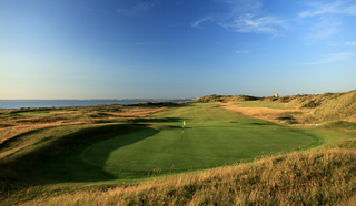 Wallasey Golf Club pictured on a sunny day with the sea beyond