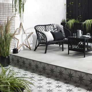 raised patio platform with patterned star tiles