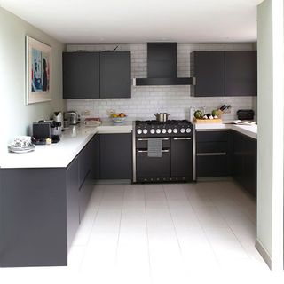 kitchen room with marble worktops and dark grey cabinets