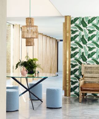 Classic palm leaf wallpaper with bamboo panelling and lounger