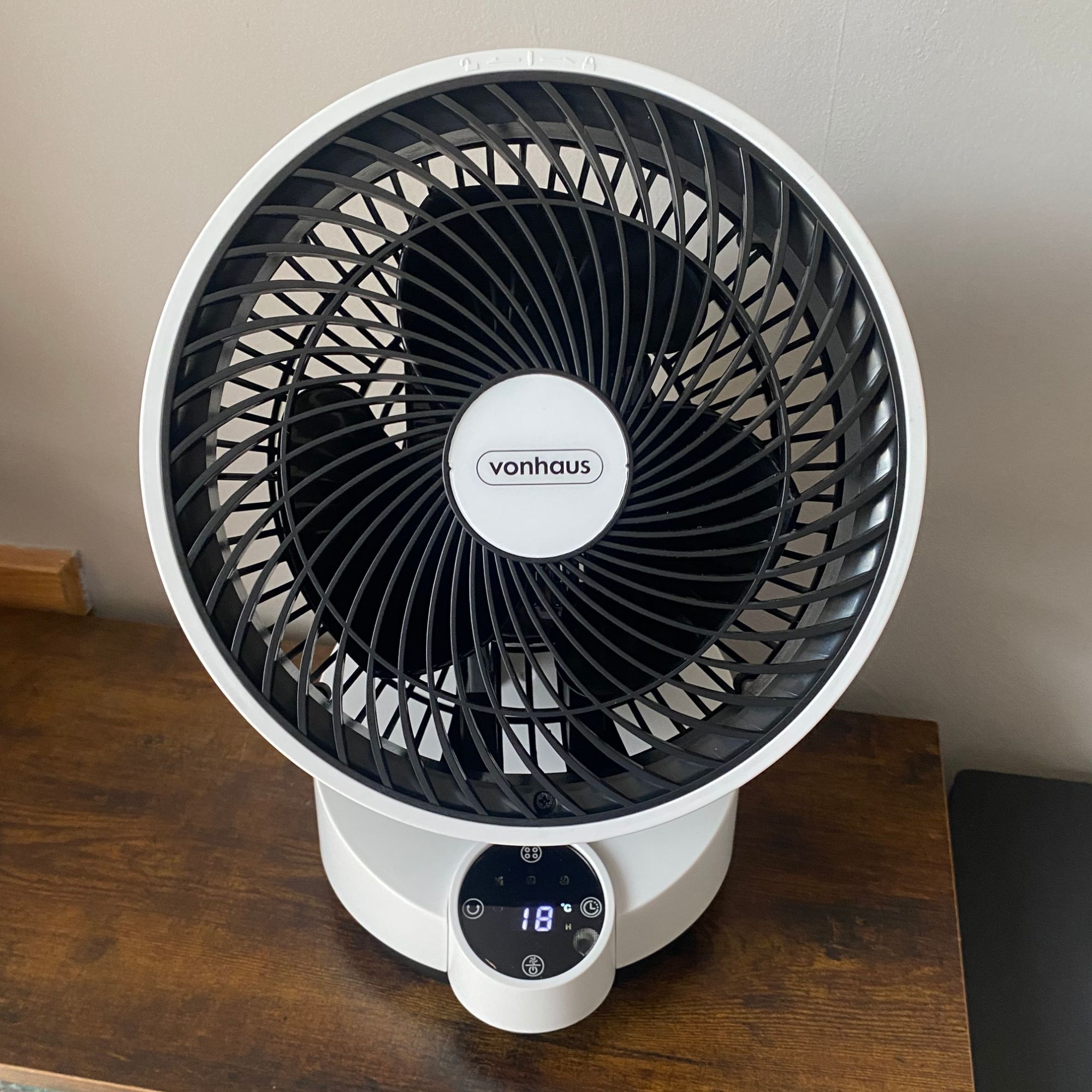 Vonhaus Air Circulator Cooling Fan in standby mode on a side table with the display showing the ambient temperature in the room