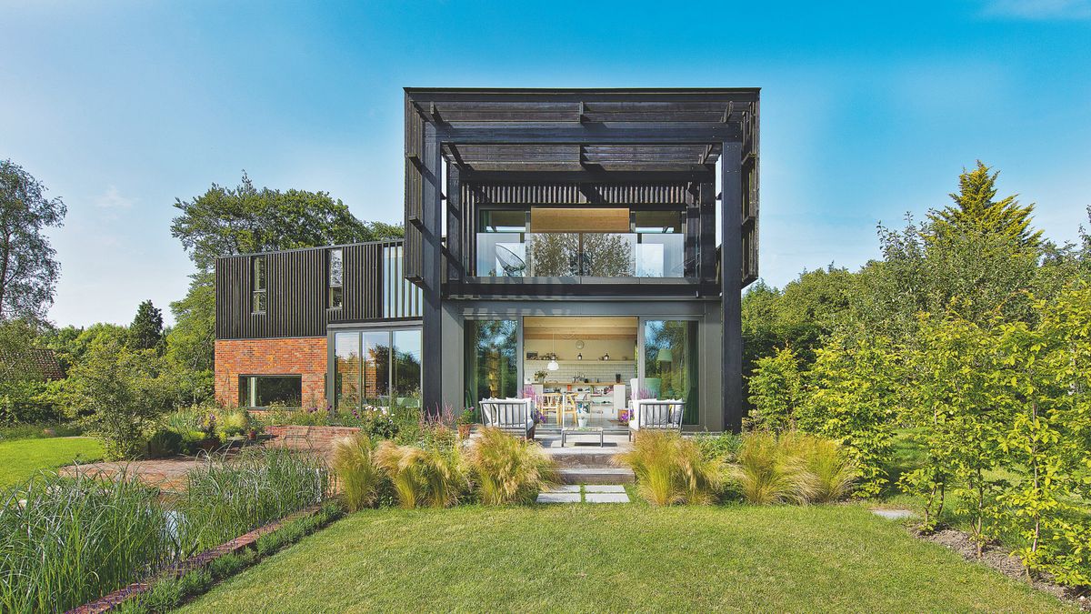 view into self build house with brick and black timber cladding