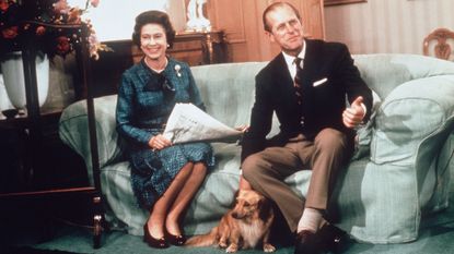Queen Elizabeth ll and Prince Phillip the Duke of Edinburgh relaxing with their corgis and newspapers at Balmoral in 1975.