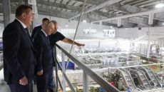 Putin is shown round a factory with no workers in it in the Kuril Islands/Japanese Northern Territories