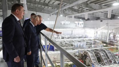 Putin is shown round a factory with no workers in it in the Kuril Islands/Japanese Northern Territories