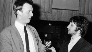 Geoff Emerick accepts a Grammy Award (for Best Engineered Recording - Non-Classical) from Beatles drummer Ringo Starr,