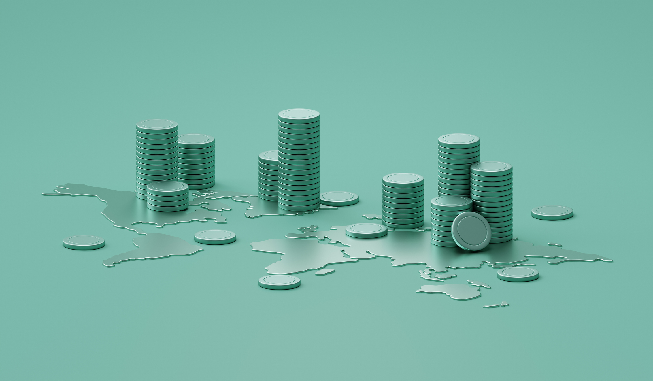 Stacks of coins piled on a world map representing global investing