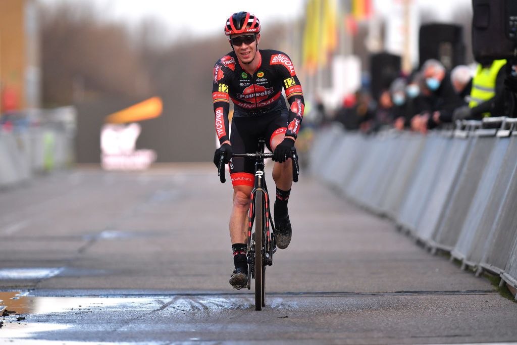 MIDDELKERKE BELGIUM JANUARY 09 Laurens Sweeck of Belgium crosses the finishing line on second place during the 105th Belgian National Cyclocross Championships 2022 Mens Elite bkmiddelkerke on January 09 2022 in Middelkerke Belgium Photo by Luc ClaessenGetty Images