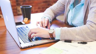 A person using a laptop.