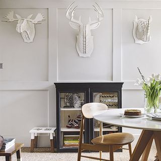 dining room with white wall and dining table