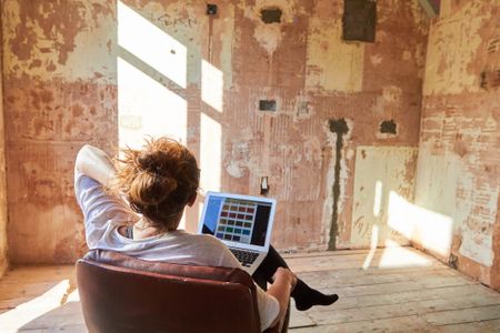 woman in chair planning refurb