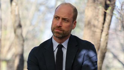 Prince William, Prince of Wales meets with students during a visit to the Bourne Academy