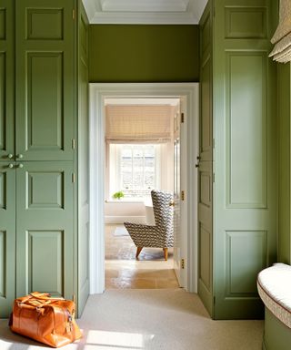 green painted cabinetry in dressing area in Georgian style Cotswolds newbuild country house