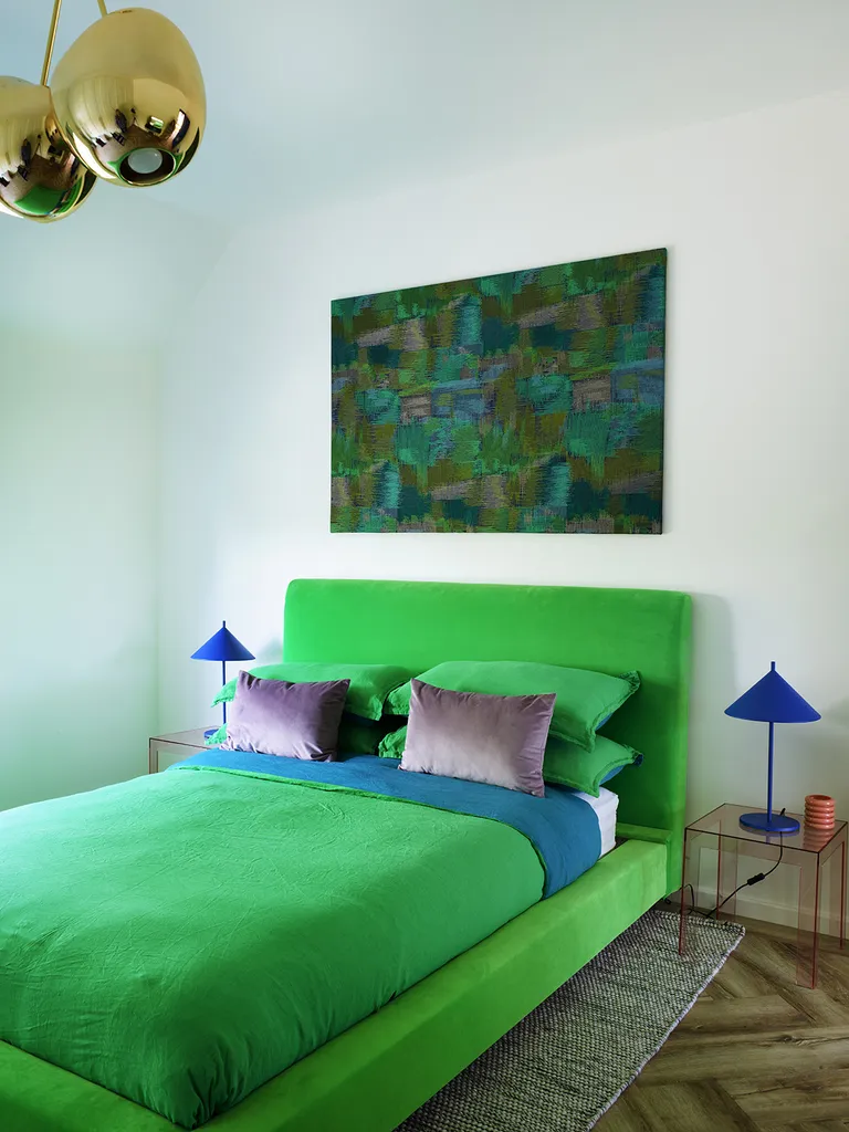 modern bedroom with bright green bed