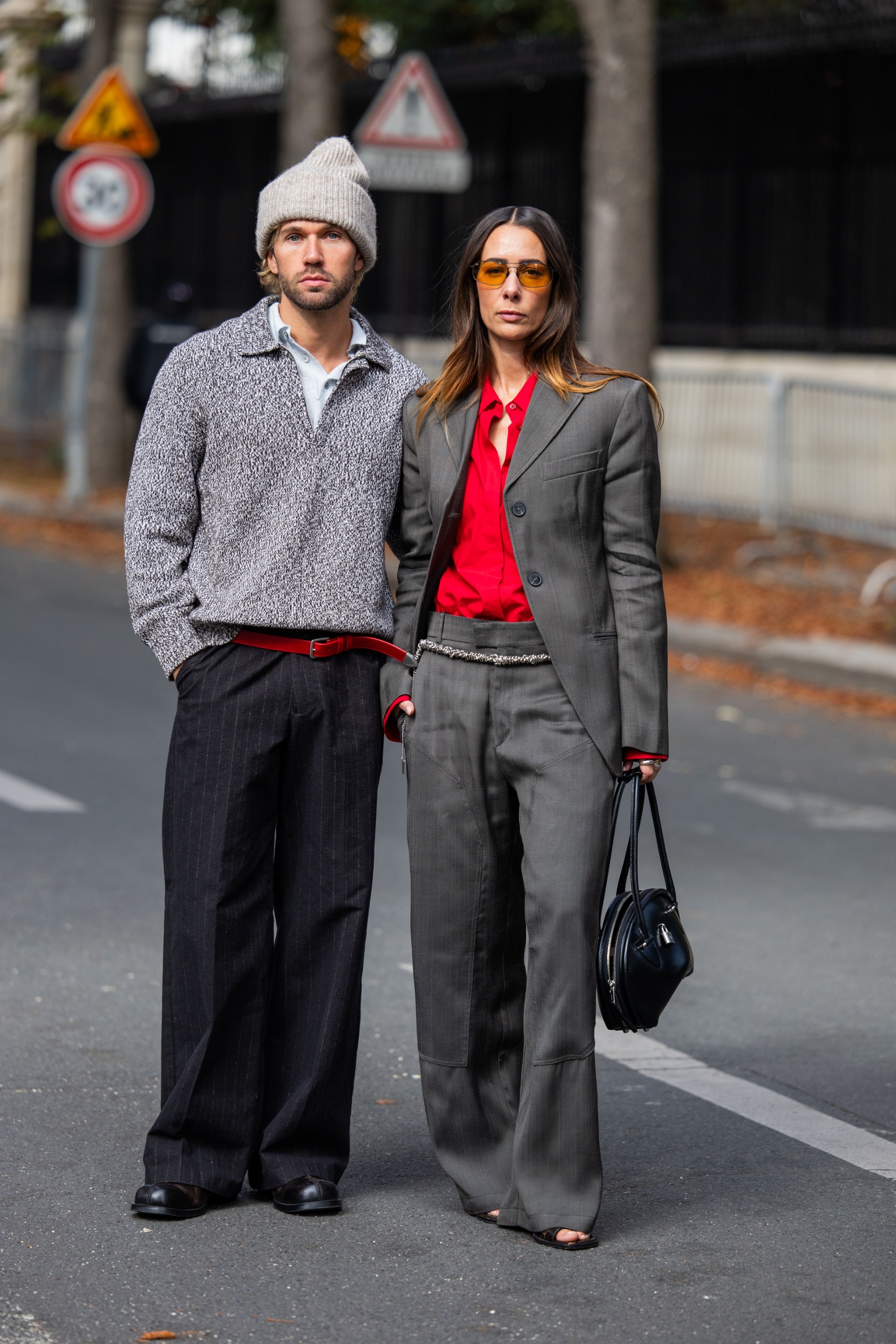 showgoer wearing red and gray color combination trend at Paris Fashion Week