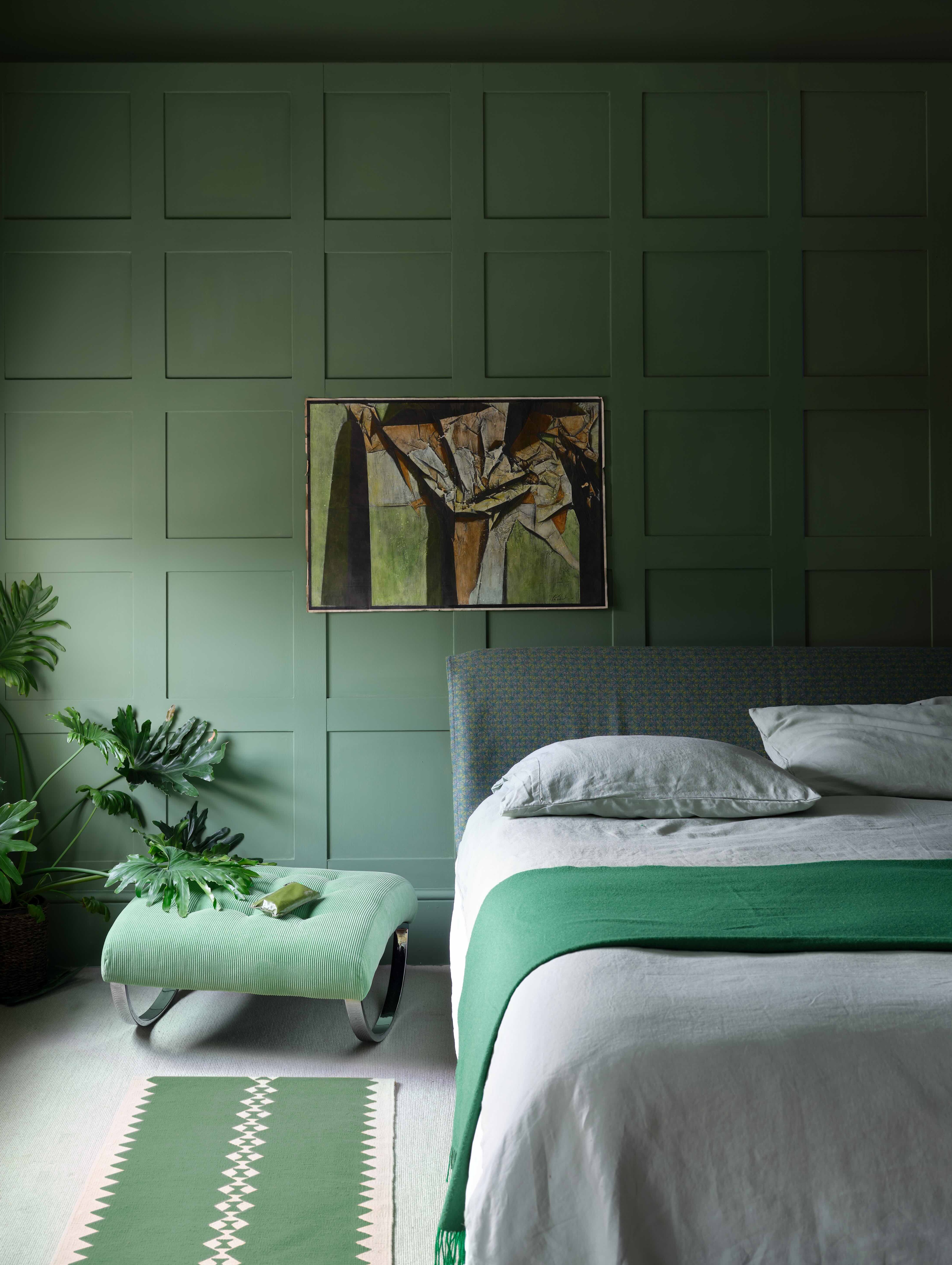 A bedroom painted in Farrow &amp;amp; Ball's Calke Green