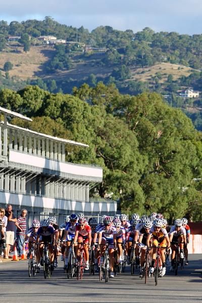 The bunch races up the finishing straight with the Adelaide Hills in the background