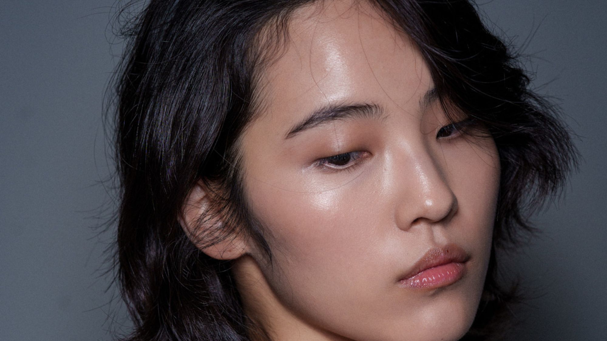 model with flawless glowing skin backstage at Stella McCartney