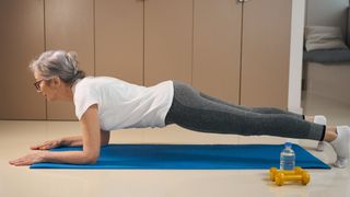 A woman doing the plank at home