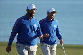 Jon Rahm and Sergio Garcia walk down the fairway at Whistling Straits