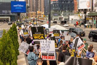 Writers Guild of America members and supporters picket outside Disney’s May 16 upfront presentation at New York’s Jacob K. Javits Convention Center. 